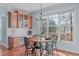 Bright breakfast nook with a view, featuring built-in cabinets for extra storage at 4228 Bibleway Ct, Holly Springs, NC 27540