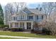 Charming two-story home featuring a welcoming front porch and classic architectural details at 4228 Bibleway Ct, Holly Springs, NC 27540