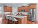 Beautiful kitchen with stainless steel appliances, granite countertops, and wooden cabinets at 4228 Bibleway Ct, Holly Springs, NC 27540