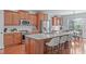 Bright kitchen featuring a large island with seating, stainless appliances and a breakfast nook at 4228 Bibleway Ct, Holly Springs, NC 27540