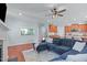 Inviting living room featuring a blue sofa, built-in aquarium and seamless flow into the kitchen at 4228 Bibleway Ct, Holly Springs, NC 27540