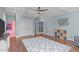 This living room features a coffered ceiling, a large rug, hardwood floors, and plenty of natural light at 4228 Bibleway Ct, Holly Springs, NC 27540