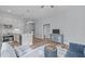 Inviting living area showcases an open layout, seamlessly connecting the kitchen and dining spaces with modern finishes at 4228 Bibleway Ct, Holly Springs, NC 27540