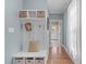 Organized mudroom with storage bench and overhead baskets for coats and shoes at 4228 Bibleway Ct, Holly Springs, NC 27540
