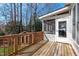 Wooden deck has a screened porch leading to a white door at 4228 Bibleway Ct, Holly Springs, NC 27540