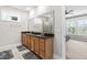 Bright bathroom with a double vanity, granite counters, and natural lighting at 424 Hopwood Way Way, Apex, NC 27523