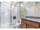 Modern bathroom featuring a glass shower, mosaic tile accent wall, and granite countertop at 424 Hopwood Way Way, Apex, NC 27523