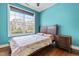 Cozy bedroom with a large window offering natural light and an exterior view at 424 Hopwood Way Way, Apex, NC 27523