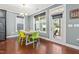 Bright dining area with natural light, contemporary table and chairs, adjacent to the kitchen at 424 Hopwood Way Way, Apex, NC 27523