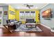 Comfortable living space with hardwood floors, two black leather sofas, and natural light at 424 Hopwood Way Way, Apex, NC 27523