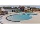 Community swimming pool and splashpad with various water features and residential houses in the background at 424 Hopwood Way Way, Apex, NC 27523