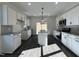 Bright kitchen features white cabinets, granite countertops and stainless steel appliances at 450 Springtooth Dr, Zebulon, NC 27597