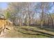 Picturesque backyard with manicured lawn and lush natural surroundings at 4605 Erwin Rd, Durham, NC 27705