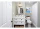 Elegant bathroom with a stylish vanity, modern fixtures, and a well-lit mirror at 4605 Erwin Rd, Durham, NC 27705