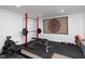 Home gym featuring weightlifting equipment, rubber flooring, and bright lighting at 4605 Erwin Rd, Durham, NC 27705
