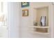 Hallway featuring a unique alcove with decorative shelving and white walls at 4605 Erwin Rd, Durham, NC 27705