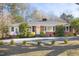 Charming single-story home featuring a brick facade and well-manicured front yard at 4605 Erwin Rd, Durham, NC 27705