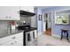 Well-lit kitchen featuring stainless steel appliances and light blue walls for a clean, modern aesthetic at 4605 Erwin Rd, Durham, NC 27705