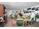 Spacious living room with a brick fireplace, colorful seating, and hardwood floors at 4605 Erwin Rd, Durham, NC 27705