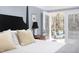 Cozy main bedroom showcasing access to a private balcony with comfortable seating at 4605 Erwin Rd, Durham, NC 27705