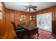 Inviting office space with hardwood floors, wood-paneled walls, and French doors to the patio at 4605 Erwin Rd, Durham, NC 27705