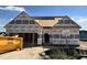 New construction home's framing with protective wrap, illustrating the early stages of the build process at 472 Springtooth Dr, Zebulon, NC 27597