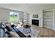 Inviting living room with fireplace, built-in shelves, and neutral décor, perfect for relaxation at 472 Springtooth Dr, Zebulon, NC 27597
