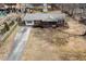 An aerial shot showcases this lovely home with its long driveway and well-manicured front yard at 4816 Stafford Dr, Durham, NC 27705