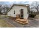 Welcoming back entrance with wooden steps and a charming door for easy access to the home at 4816 Stafford Dr, Durham, NC 27705