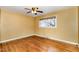 Bedroom with hardwood floors, a large window with blinds, and neutral-colored walls at 4816 Stafford Dr, Durham, NC 27705
