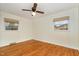 Bedroom with hardwood floors, a ceiling fan, and natural light from two windows with blinds at 4816 Stafford Dr, Durham, NC 27705