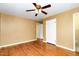 Spacious bedroom with beautiful hardwood floors, a ceiling fan, and natural light from a window at 4816 Stafford Dr, Durham, NC 27705