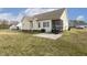 Back exterior featuring a screened porch, patio, grill, and spacious lawn at 55 Oak Leaf Dr, Lillington, NC 27546