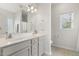 Bright bathroom featuring double sinks and large mirror with ample counter space at 55 Oak Leaf Dr, Lillington, NC 27546