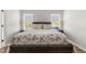 Inviting primary bedroom featuring floral bedding and side tables with lamps at 55 Oak Leaf Dr, Lillington, NC 27546