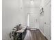 Bright entryway with bench, coat hooks, and decor at 55 Oak Leaf Dr, Lillington, NC 27546