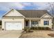 Attractive single-Gathering home featuring a charming front porch and attached two-car garage at 55 Oak Leaf Dr, Lillington, NC 27546
