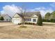 Charming single-Gathering home with a two-car garage and well-maintained landscaping at 55 Oak Leaf Dr, Lillington, NC 27546