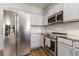 Updated kitchen featuring stainless steel appliances and ample cabinet space at 55 Oak Leaf Dr, Lillington, NC 27546
