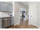 Contemporary kitchen featuring stainless steel dishwasher and view to living room at 55 Oak Leaf Dr, Lillington, NC 27546