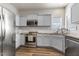 Well-lit kitchen features stainless steel appliances and light blue cabinetry at 55 Oak Leaf Dr, Lillington, NC 27546