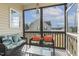 Relaxing screened porch with comfortable seating and views of the backyard at 55 Oak Leaf Dr, Lillington, NC 27546