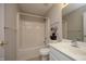 Bathroom featuring a shower-tub combo, white fixtures, and a functional layout at 5526 Spindlewood Ct, Durham, NC 27703