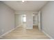 Bright bedroom featuring mirrored closet doors, a ceiling fan, and a serene neutral palette at 5526 Spindlewood Ct, Durham, NC 27703
