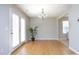 Bright dining room with a chandelier and access to the outdoor patio at 5526 Spindlewood Ct, Durham, NC 27703