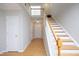Inviting foyer with wood floors and staircase at 5526 Spindlewood Ct, Durham, NC 27703