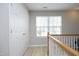 Upstairs hallway with closet and staircase at 5526 Spindlewood Ct, Durham, NC 27703