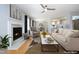 Staged living room with fireplace, modern furniture, and an open concept layout at 5526 Spindlewood Ct, Durham, NC 27703