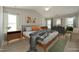 Staged main bedroom with wooden furniture at 5526 Spindlewood Ct, Durham, NC 27703