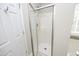 Shower with sliding glass doors and updated fixtures, providing a refreshing and modern experience at 5526 Spindlewood Ct, Durham, NC 27703